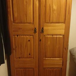 double wardrobe, tall chest of drawers, and bed side cabinet.