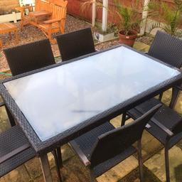 6 Black ratton chairs
Heavy glass table
Used but still lots of life
Plus blue seat pads 
