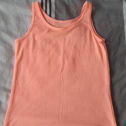 girls coral colour vest top. 
age 8/9years.
