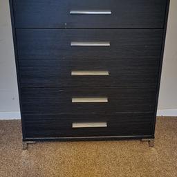 5 drawer in black, there are a couple of slight marks on the front and a small scuff to the top (please see pic) 1x drawer the bottom has slightly come away (please see pic) but can easily be sorted. 
Measurments - Height 90cm, Width 79cm and Depth 39cm.