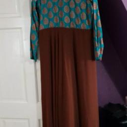 Long Maxi Anarkali Dress. Used twice but excellent condition. Ready stiched dress. Teal body with brown embriodery. Zip at the back and full sleeves.size 10/12

￼