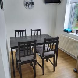 Ikea table and chairs set. 
Black wooden chairs and  black wooden table with metal legs. Cushions included. 

From a smoke free home. 

Used but in very good clean condition. 

£50 ono

Collection only