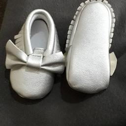baby shoes new without tags kept in storage so can't remember size but looks like size 1