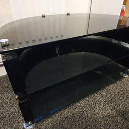 Tv stand, black glass. In good used condition.