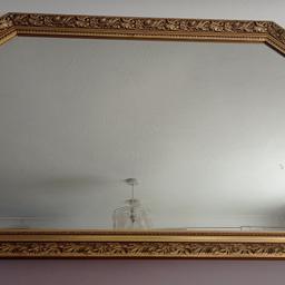 large wall mirror with gold design frame. 1030mm by 725mm