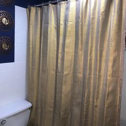 Gold shower curtain silver and grey pole couple months old really good condition. Can drop locally