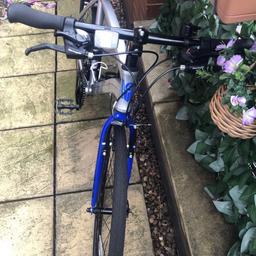 Light weight silver and blue hybrid bike. Barely used for less than half the price !