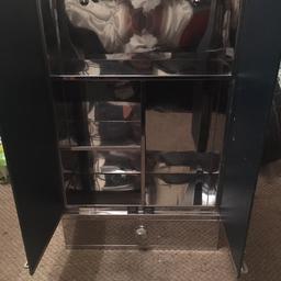 Cabinet  with mirrors drawer shelves inside put in your bathroom front room wherever to the wall
The length is 1 foot18  width 8 and top to bottom is 2 foot 29 in excellent condition no time wasters please