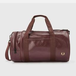 Brand new unused Fred Perry burgundy barrel bag. suitable for gym, work. will send via royal mail 1st class signed for.