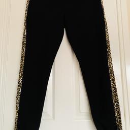 For sale black women's pants type tracksuits-jogger, with a leopard stripe on the side, size 16, like new! 