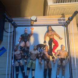 WWE ring with 6 wrestling figures including the rock and John cena