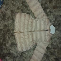 baby girls pink moncler coat age 12-18 months this jacket has a mark around the sleeve im not sure if it will come out or not flaws reflect in price