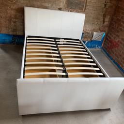 cream faux leather double bed for sale. in good condition and all slats . you will need to buy slat clips that you can get on ebay as shown in the pic as some have gotten lost or broken over time. No mattress.  *PICKUP ONLY*