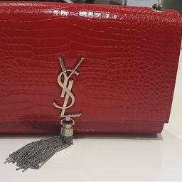 MONOGRAM SAINT LAURENT BAG, INTERLOCKING YSL INITIALS IN METAL AND A METALLIC TASSEL.

100% CALFSKIN LEATHER
DIMENSIONS: 20 X 12,5 X 5 CM
MAGNETIC SNAP CLOSURE
SILVER-TONED METAL HARDWARE
INSIDE SLOT POCKET
STRAP DROP: 56 CM
Excellent conditiom just a little mark at the bag which you can't notice much. I am looking to reduce my bag collection as i rarely use it. 100% GENUINE, comes with box, dust bag and authenticity card no receipt