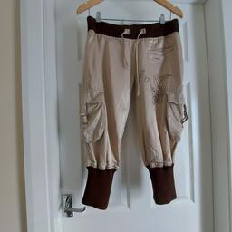 Breeches " Soccx "FR MR Collection Silver Beige and Brown Mix Colour
Good condition

Actual size: cm

Length: 72 cm measurements from hips front

Length: 75 cm measurements from hips back

Length: 72 cm measurements from hips side

Volume Waist: 70 cm – 94 cm

Volume Hips: 94 cm – 97 cm

Size: S,10 (UK)

60 % Cotton
40 % Viscose

Made in Turkey