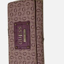 Guess designer purple purse,hardly used. gd condition lots of card sections along with change,notes etc
