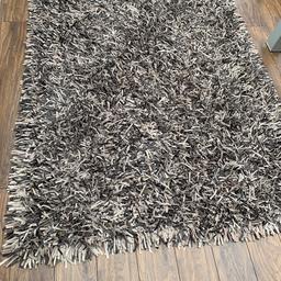 Spaghetti leather rug in brown. Real leather brought from leather by design cost me £450