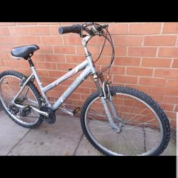 Raleigh Womens Road bike. It has front suspension and has 26 inch tyres. It is in excellent condition