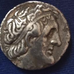 Ptolemy 11 Genuine Philadelphas Silver Tetradrachm 285/246 B.C Obv Laureate Head Right Reverse Eagle Standing Left Diameter 24mm max weight 12.31 grams clipped in Antiquity toned with rough surfaces.