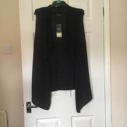Navy blue sparkling sleeveless top great for putting over tops in the summer ,costed 30 pound from next excellent condition collection only