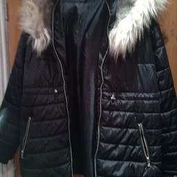 Selling a black coat  with fur around the hood brand new having a clear out collection only please as I don't drive