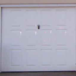 White up and over frameless garage door with 2 keys. Free to good home, slight crazing on the outside of one bottom panel that does not affect integrity of the door. In good working order, has now been replaced and is free to anyone who can collect it.  Wordsley area.  See photos for style and measurements.