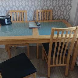 Solid oak table with frosted glass inserts and four chairs with leatherette seating.
Sizes  55.5" wide x 31.5" depth x 29" high very good condition with removable legs.£150
Pick up from hackenthorpe S12