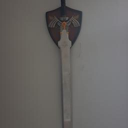 A Legend of Zelda wall ornament in the style of Dark Link. Comes with Hylian crest back board for hanging, just drill a hole where you want to put it and boom.
Roughly 4 feet long (couldn't find my tape to measure) and has a bit of weight to it. Bought at a convention in Sheffield a few years ago.

Collection only as I've no way to package and send this and, like I said, it weighs a bit.