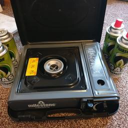 never used camping cooker with 4 cans.