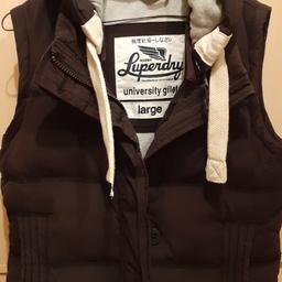 ladies Superdry gilet large but Superdry does come small so more like a medium worn but in good condition duck and feather filling navy in colour