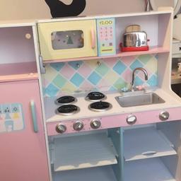 The kitchen is been used but in good condition. The toys on picture included.