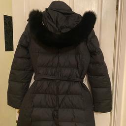 Very good used condition with real fur hood. 2 pockets and belt size 12.