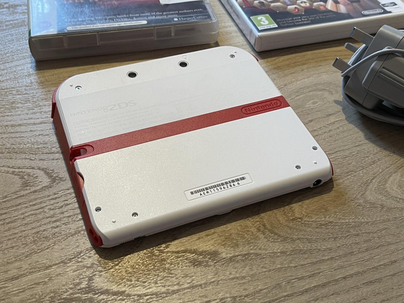 Nintendo 2DS Console, White/Red + 2 Games in B70 West Bromwich for £39.