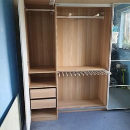 Ikea Wardrobe With Mirrored Sliding Doors. ACESSORIES INCLUDED.

Large Section with sliding doors measures
(201cm H x 200cm W x 44cm D)
Small Section
(201cm H x 49.5cm W x 60cm D)

Some minor scuff on the inside of the door on the small wardrobe, the back panel where nails have been removed and one of the shelves which can be placed at the bottom so is not visible.

YOU WILL NEED A VAN TO TRANSPORT AS THERE ARE LARGE PIECES, TWO PEOPLE RECCOMENDED. WE CANNOT HELP DUE TO COVID.

Dismantled.