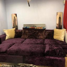 Purple crushed velvet large sofa. The pictures really don’t do this justice it comes complete with matching cushions and a large sitting cushion which can be arranged as a l shaped sofa I also have purple chaise which you can have. All in mint/ like new condition 
 Genuine reason for selling this I’m converting my cinema room into a Gym. Get a bargain this was over £ 3000. Pounds without the chaise