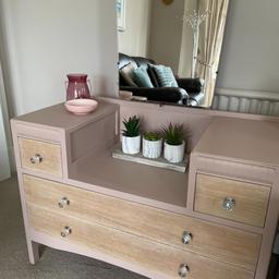 A vintage dressing table which has been newly painted using Frenchic 'Nougat' (a vintage pink colour).  The unit can be used with or without the mirror.  The drawers fronts have been sanded and waxed for protection.  The mirror tilts.
Measurements:- 91cm wide, 42cm deep, 66cm tall to the top of the drawers (134cm tall to to top of the mirror).