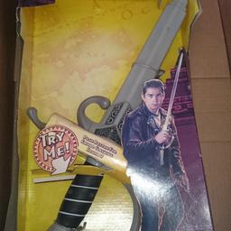 sword from indiana jones , it extends  and has sounds , will need batteries.

kingdom of the crystal skull sword.

never taken out of box, box has wear n tear from storage over the years