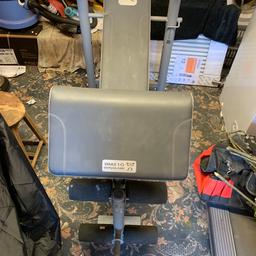 Weight bench with various weights plus bar