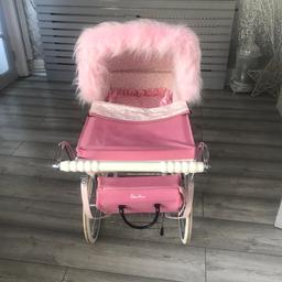 Lovely pink silver cross dolls pram with matching bag. Shopping tray underneath. Pink fur Trim. Padded mattress. Pink cosy toes and pillow