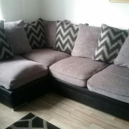 grey and black fabric corner sofa very good condition with scatter cushions.Very good condition still.Will be wanting gone in 3 weeks time.your welcome to come and view it before you buy.Pick up only