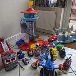 large selection of paw patrol vehicles and characters, including large lookout tower, paw patroller, fire engine, X2 helicopter transporters.