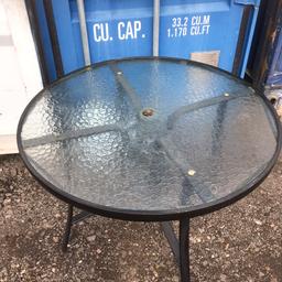 Garden table glass top with the centre hole for parasol sizes is 102 cm in diameter made of aluminium no rust in good condition delivery can be arranged locally in Birmingham any questions just message us ,thanks for viewing.