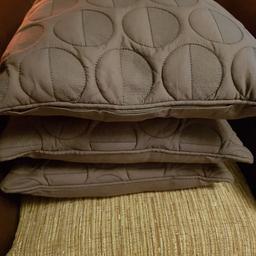 3x grey cushions in good condition ope. To offers