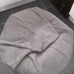Large grey soft velour beanbag with back rest, 90cm diameter.

Collection from  blackwater.