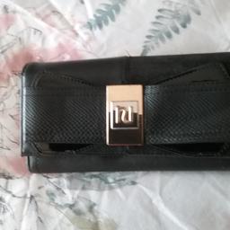 ladies black wallet purse has lots of room iside 2 compartments