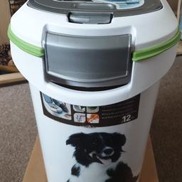 Dogs food container on wheels, scoop attached to lid for easy portion measuring. Main lid opens to empty food sacks small lid opens to portion control. Can be moved anywhere in the house