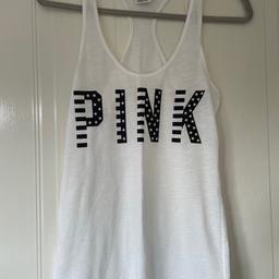 Pink Victoria Secret woman’s white vest top with American flag PINK text. in very good condition. Size small.