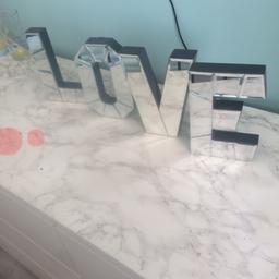 As seen, mirrored letters. Good as new perfect condition. Free stamd or wall mount. 12 for all