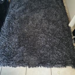 in great condition
a darker grey in colour shaggy style 
the rug is 120 x 170 cm in size
pet and smoke free home