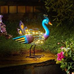 🦚 LED Peacock 🦚This decorative colourful Peacock Spiralight is a fun addition to any garden. Featuring warm white copper LEDs. Décor by day, light by night. Automatically illuminates at night. Charges in direct sunlight. Size: L26.5 x H23 x W15cm.
